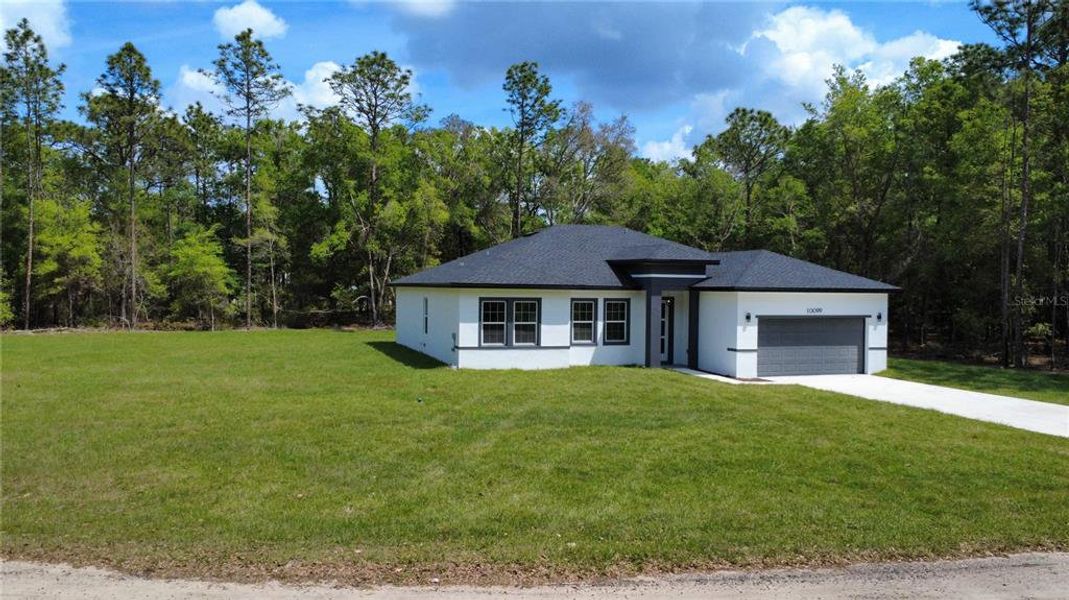 Front exterior of a new home in , Citrus Springs, FL, highlighting curb appeal (Image 1). Front exterior of a new home in , Citrus Springs, FL, highlighting curb appeal (Image 1).