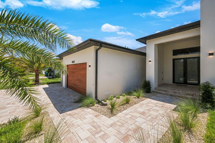 Front exterior of a new home in , Port Charlotte, FL, highlighting curb appeal (Image 1).