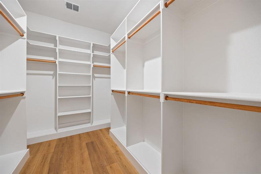 Walk in closet featuring light wood-type flooring
