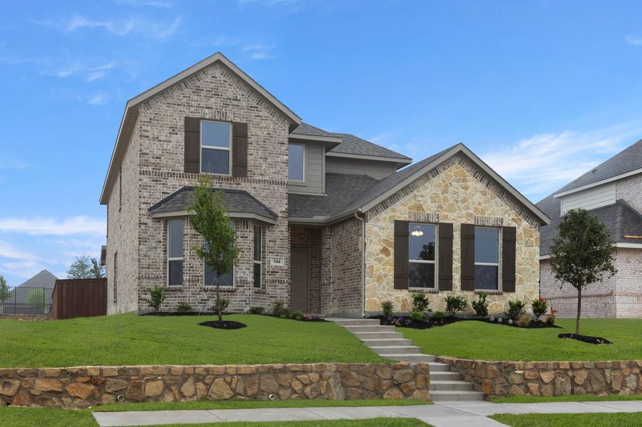 Front exterior of a new home in Redden Farms, Midlothian, TX, highlighting curb appeal (Image 2). Front exterior of a new home in Redden Farms, Midlothian, TX, highlighting curb appeal (Image 2).