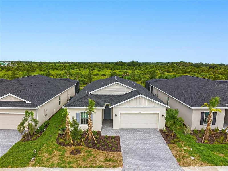 Front exterior of a new home in , Punta Gorda, FL, highlighting curb appeal (Image 2). Front exterior of a new home in , Punta Gorda, FL, highlighting curb appeal (Image 2).