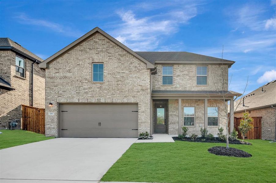 Front exterior of a new home in Aspire at Reunion, Newark, TX, highlighting curb appeal (Image 1). Front exterior of a new home in Aspire at Reunion, Newark, TX, highlighting curb appeal (Image 1).