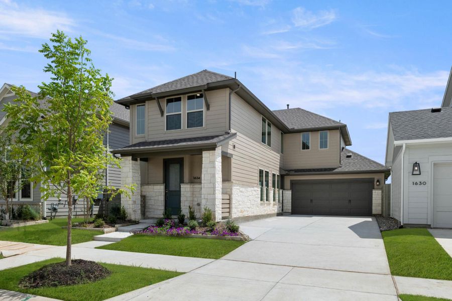 Front exterior of a new home in Garden Collection at Harvest, Argyle, TX, highlighting curb appeal (Image 2). Front exterior of a new home in Garden Collection at Harvest, Argyle, TX, highlighting curb appeal (Image 2).