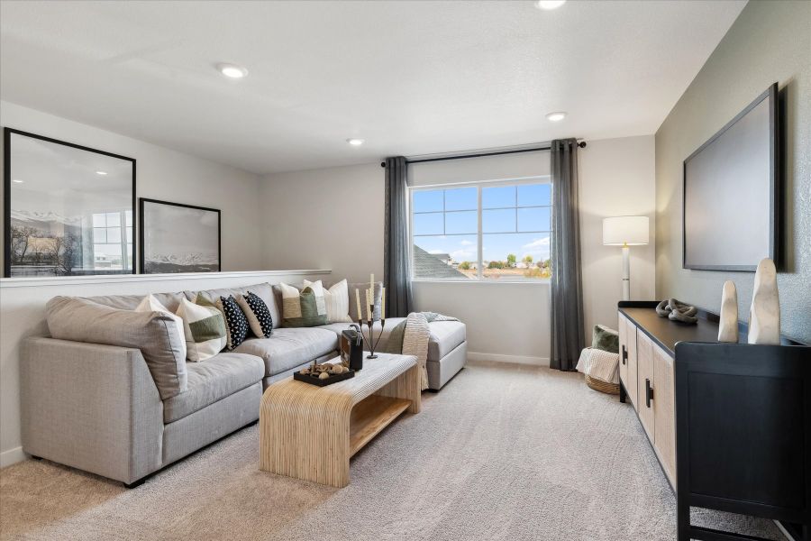 A living room with a large window. A living room with a large window.