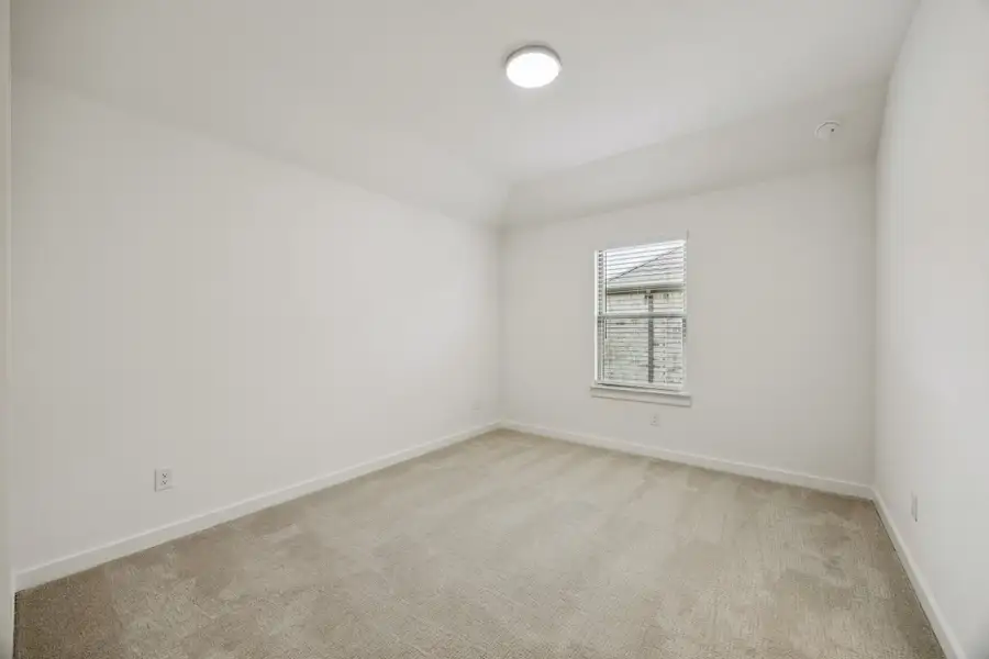 Bedroom in the Monet II home plan by Trophy Signature Homes – REPRESENTATIVE PHOTO