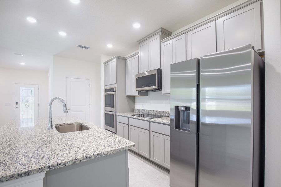 Furnished interior view inside a new home in Heritage Station, Punta Gorda (Image 6).