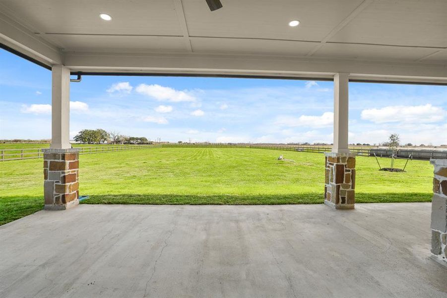 With a view like this, this covered Back Porch will be your favorite place to pass the time. Imagine sipping your morning coffee from a rocking chair in this very spot.