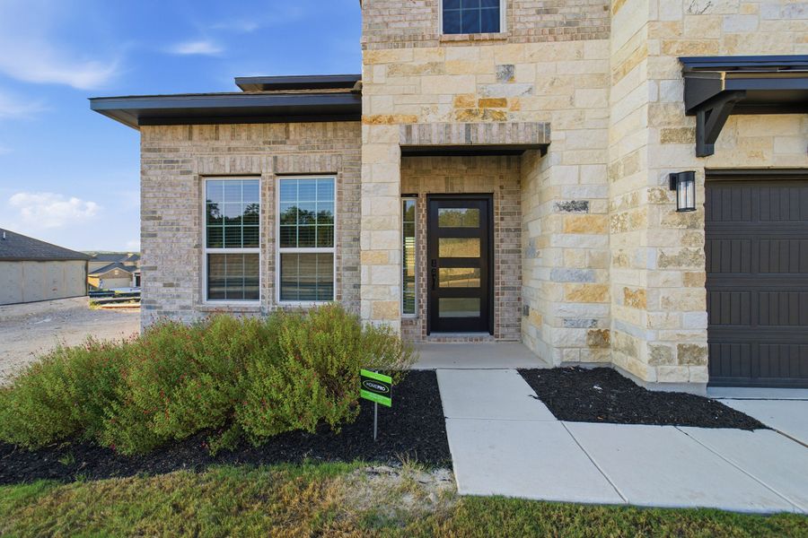 Exterior details and patio area of a home in The Woodlands at Medina Hills, Mico (Image 3).