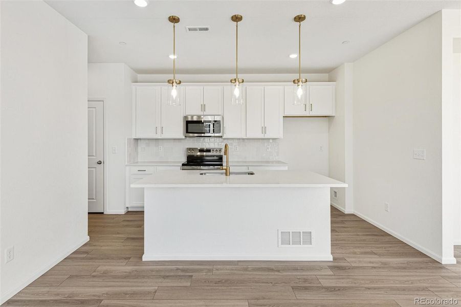 Furnished interior view inside a new home in Turnberry Villas, Commerce City (Image 6).