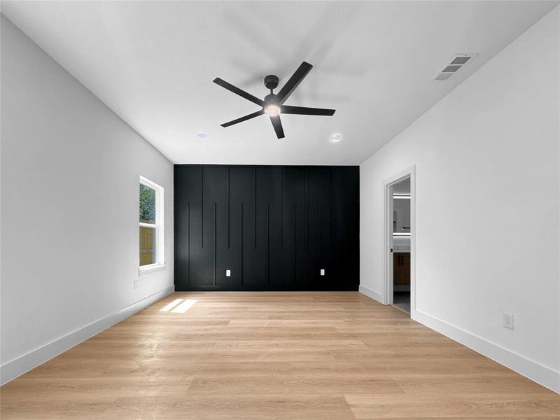 Unfurnished bedroom with light wood-type flooring and a ceiling fan