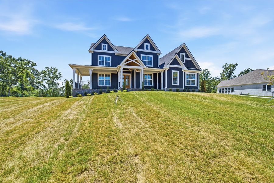 Front exterior of a new home in Belvoir, Fairview, TN, highlighting curb appeal (Image 2). Front exterior of a new home in Belvoir, Fairview, TN, highlighting curb appeal (Image 2).