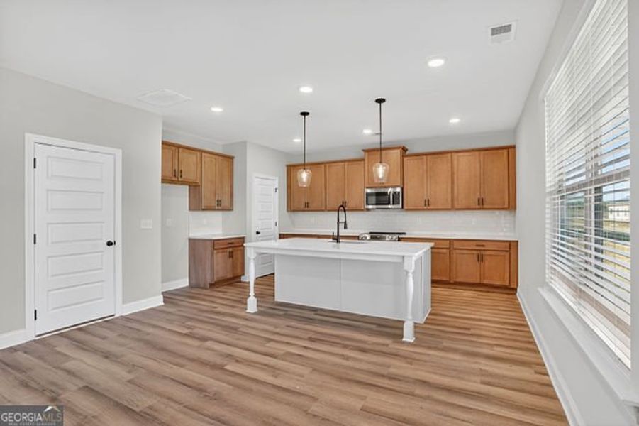 Furnished interior view inside a new home in Stone Brooke, Gray (Image 6).