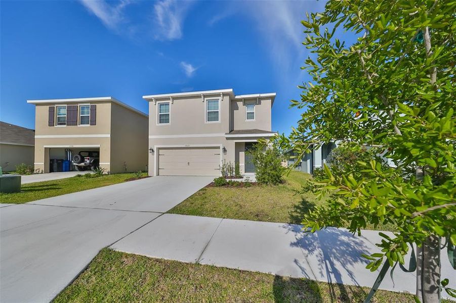 Front exterior of a new home in Southshore Bay, Wimauma, FL, highlighting curb appeal (Image 25). Front exterior of a new home in Southshore Bay, Wimauma, FL, highlighting curb appeal (Image 25).