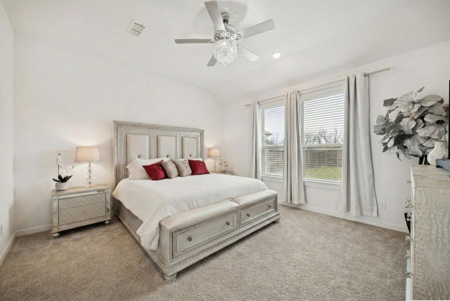 THIS VIEW OF THE PRIMARY BEDROOM SHOWS THE MASSIVE SPACE AVAILABLE FOR OVERSIZED FURNITURE.
