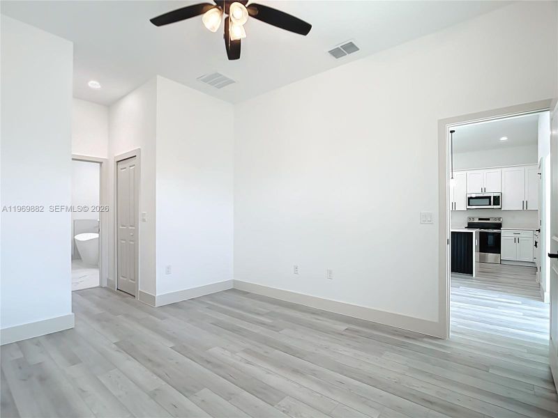 Spacious, unfurnished interior of a new home in , Port Charlotte (Image 23).