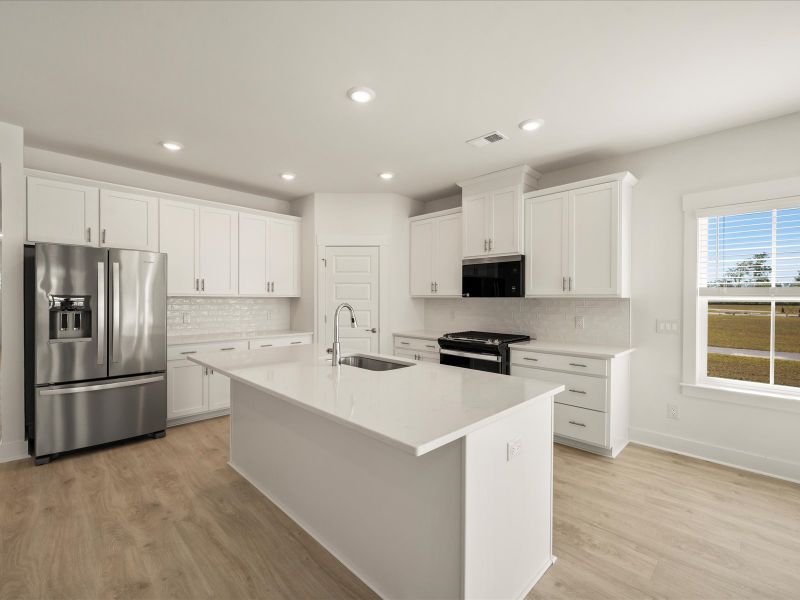 Furnished interior view inside a new home in The Coves at Lakes of Cane Bay, Summerville (Image 10).