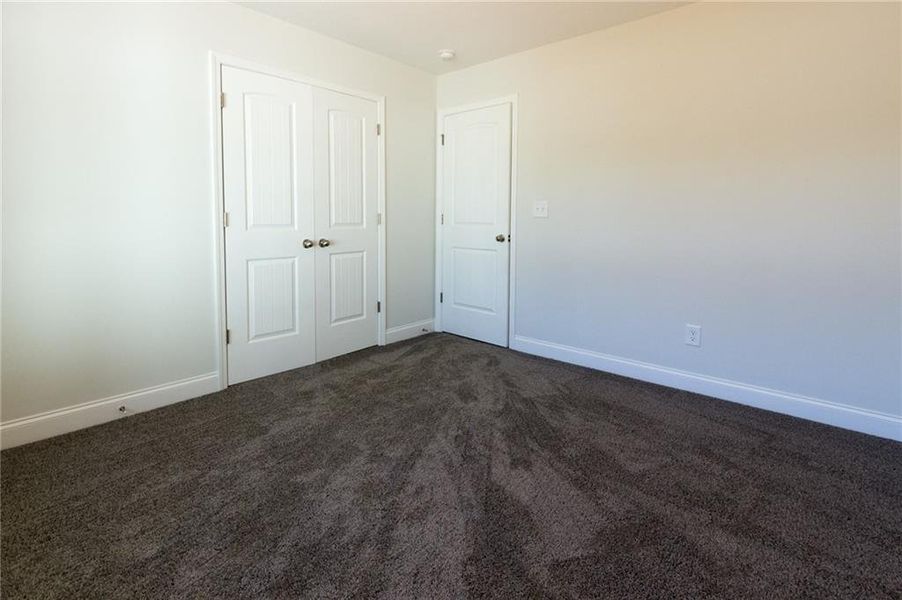 Empty room featuring carpet