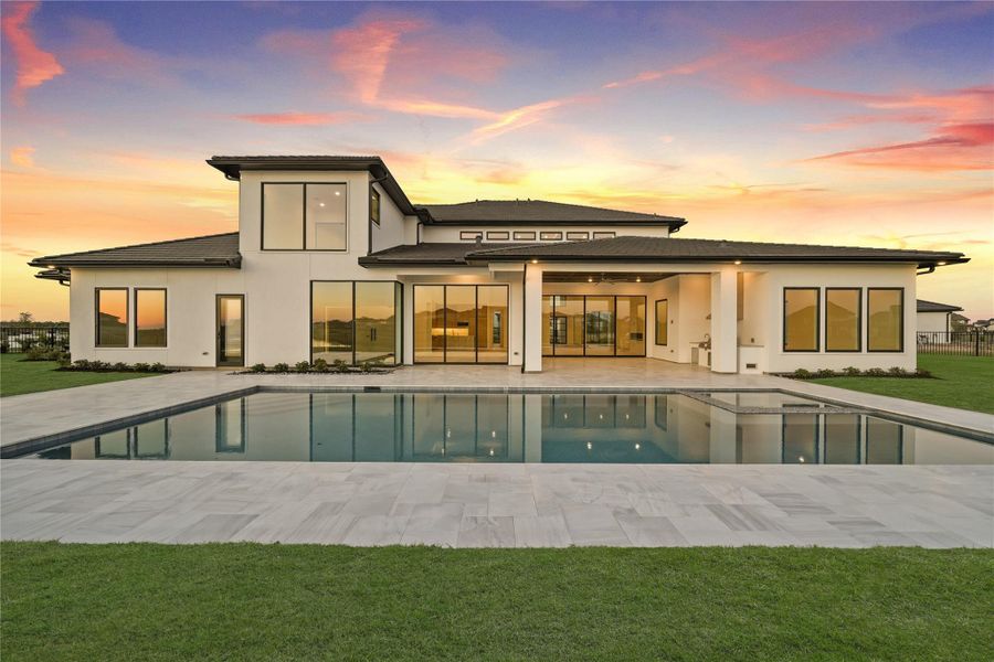 Large backyard featuring a pool and hottub, creating a modern outdoor oasis ideal for entertaining or everyday enjoyment Large backyard featuring a pool and hottub, creating a modern outdoor oasis ideal for entertaining or everyday enjoyment