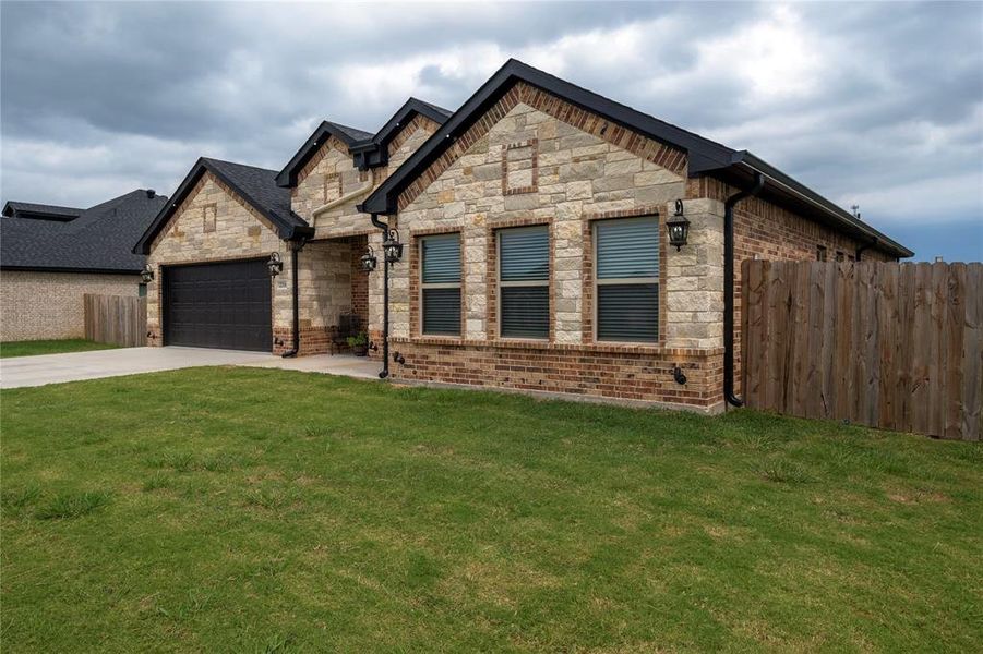 Front exterior of a new home in , Mabank, TX, highlighting curb appeal (Image 23).