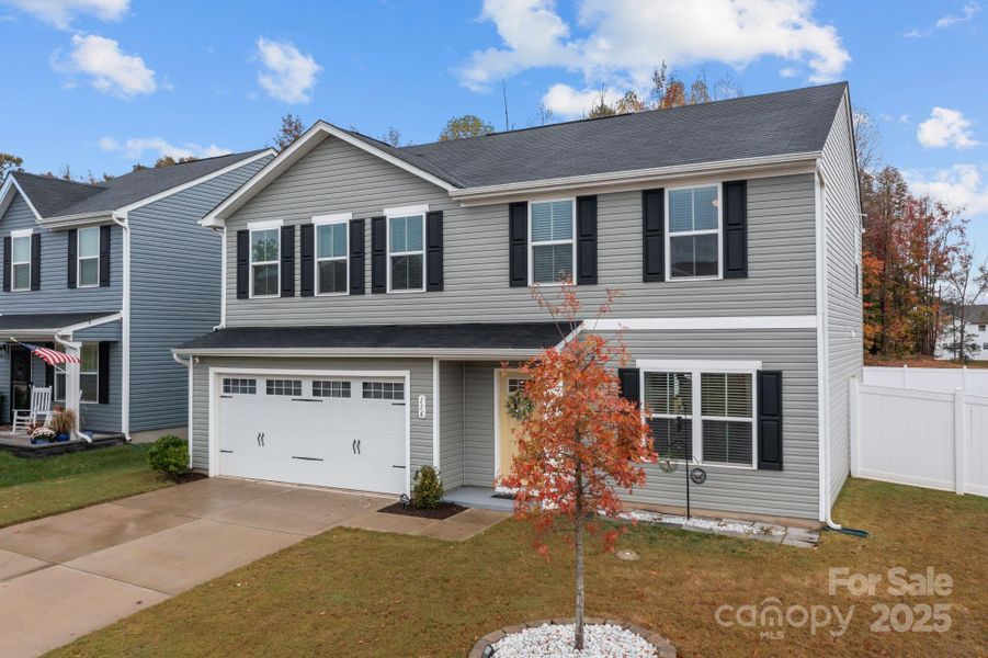 Front exterior of a new home in , Troutman, NC, highlighting curb appeal (Image 24).
