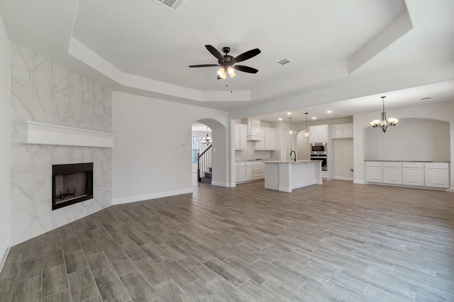 Family Room to Kitchen | Concept 2972 at Villages of Walnut Grove in Midlothian, TX by Landsea Homes