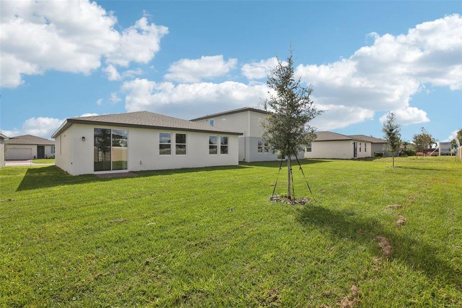 Exterior details and patio area of a home in Lawson Dunes - Signature Series, Haines City (Image 28).