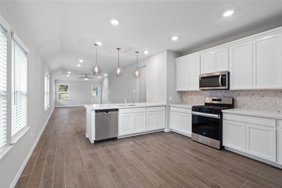 From the expansive kitchen, enjoy seamless sightlines across the open-concept living and dining areas, making entertaining a breeze and ensuring you're never far from the conversation.