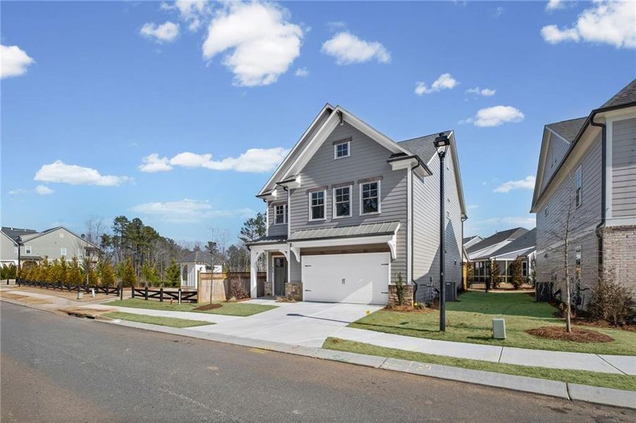 Front exterior of a new home in , Canton, GA, highlighting curb appeal (Image 24).