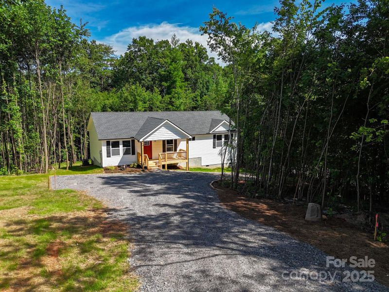 Front exterior of a new home in , Candler, NC, highlighting curb appeal (Image 27). Front exterior of a new home in , Candler, NC, highlighting curb appeal (Image 27).