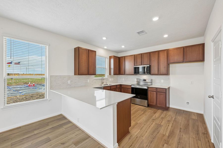Convenient breakfast bar addition, perfect for casual dining and entertaining.