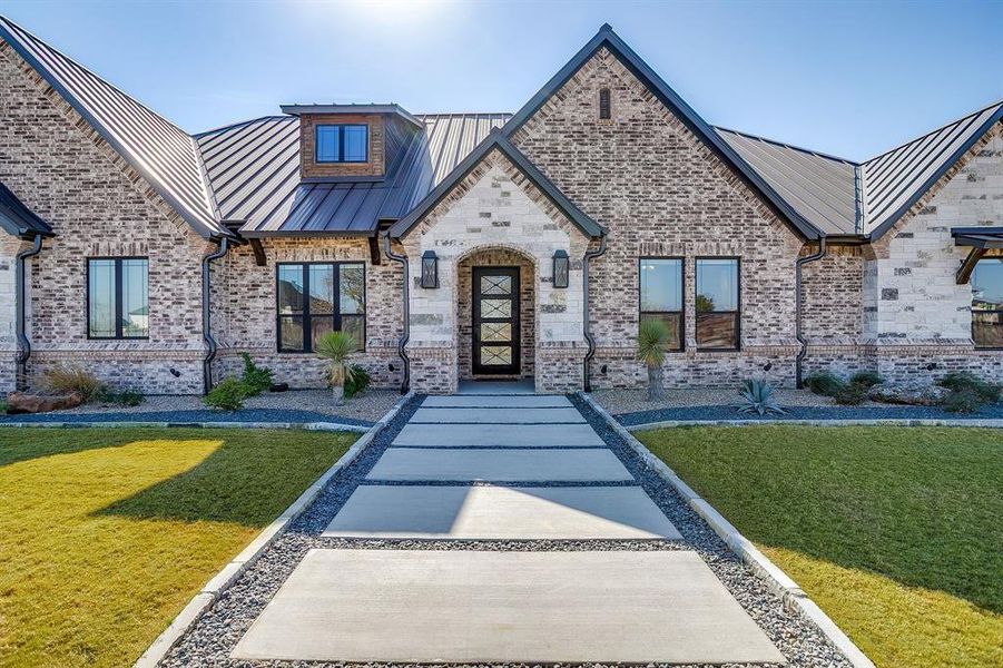 Front exterior of a new home in Santana Ridge, Weatherford, TX, highlighting curb appeal (Image 23). Front exterior of a new home in Santana Ridge, Weatherford, TX, highlighting curb appeal (Image 23).