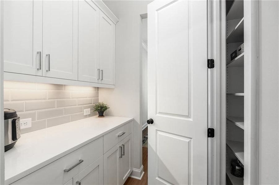 Furnished interior view inside a new home in , Johns Creek (Image 11). Furnished interior view inside a new home in , Johns Creek (Image 11).