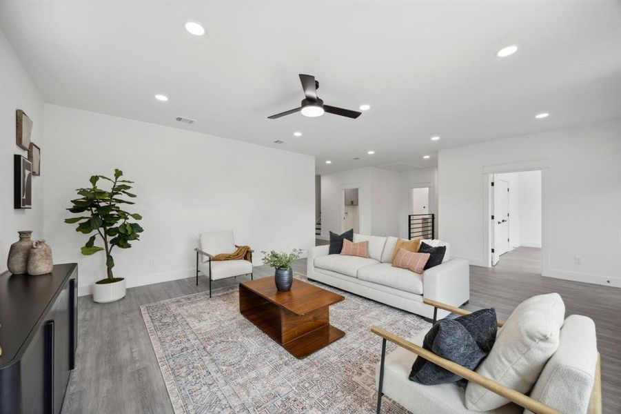 2nd floor living room featuring wood-style flooring and ceiling fan