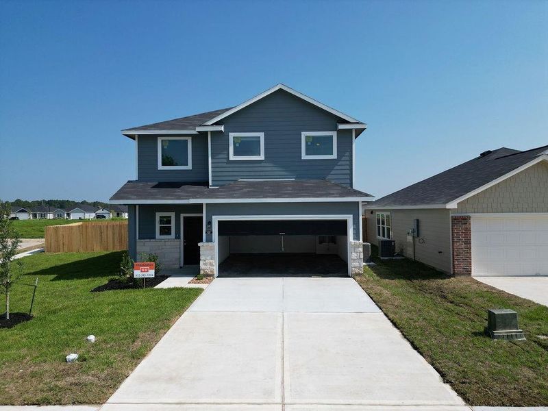 Front exterior of a new home in , Dayton, TX, highlighting curb appeal (Image 1). Front exterior of a new home in , Dayton, TX, highlighting curb appeal (Image 1).