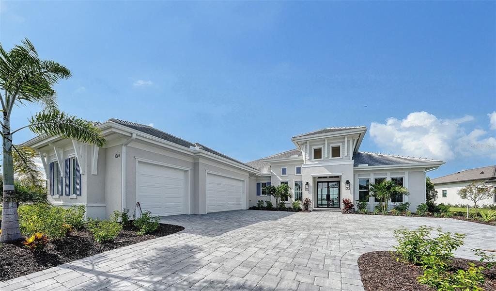 Front exterior of a new home in , Sarasota, FL, highlighting curb appeal (Image 24). Front exterior of a new home in , Sarasota, FL, highlighting curb appeal (Image 24).