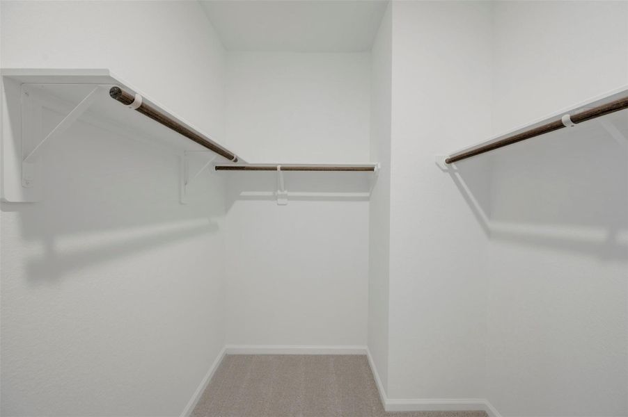 Primary walk-in closet Primary walk-in closet