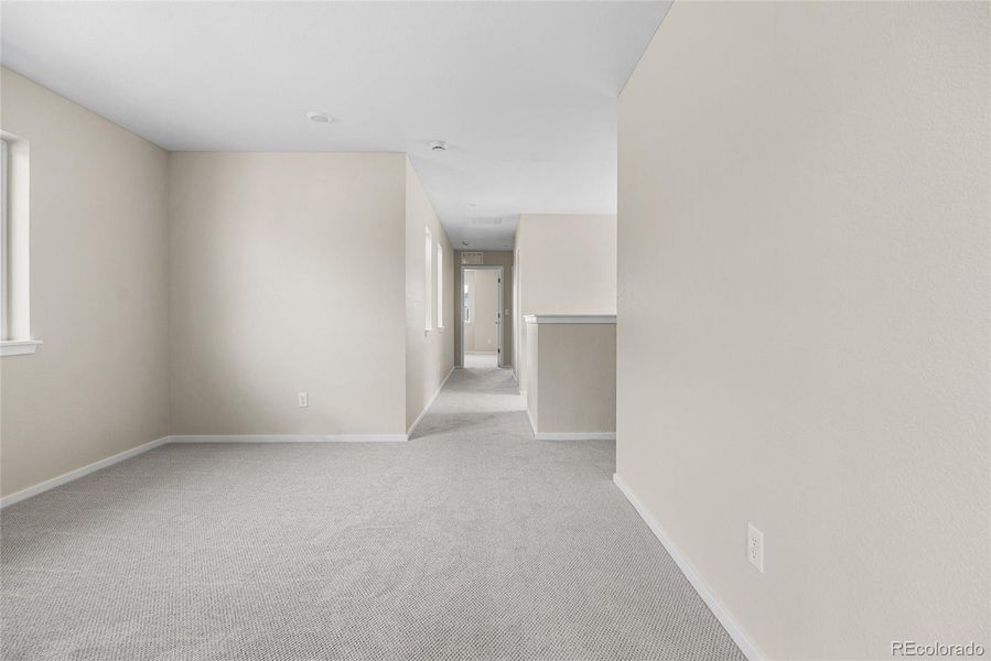 Spacious, unfurnished interior of a new home in Barefoot Village, Firestone (Image 17).