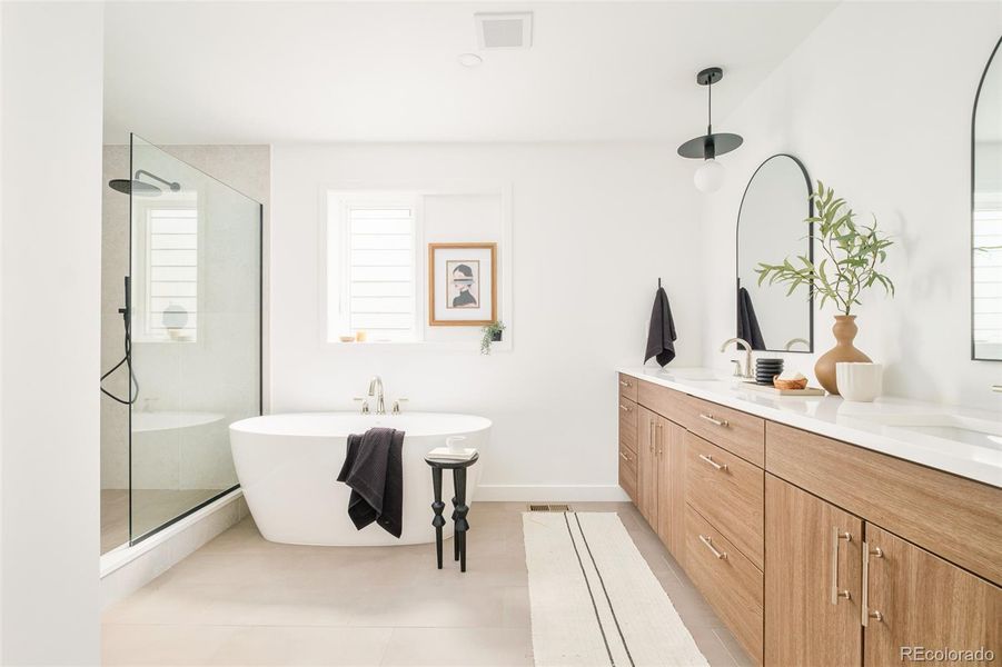 Spa-like 5-piece primary suite bath with walk-in shower, soaking tub, double vanity, and private water closet