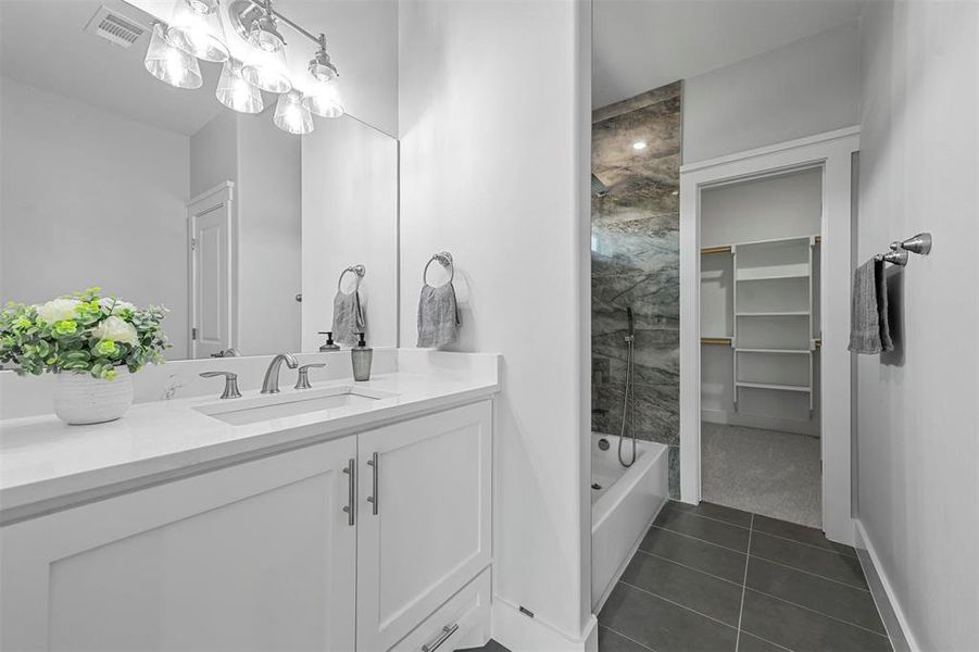 Bathroom with vanity and tile patterned floors