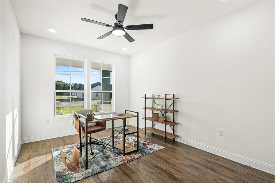 Office with dark wood-type flooring, recessed lighting, and a ceiling fan