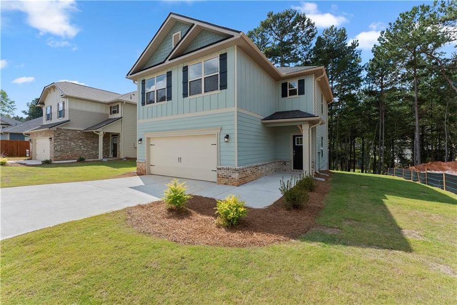 Front exterior of a new home in Magnolia Villas, Cornelia, GA, highlighting curb appeal (Image 24). Front exterior of a new home in Magnolia Villas, Cornelia, GA, highlighting curb appeal (Image 24).