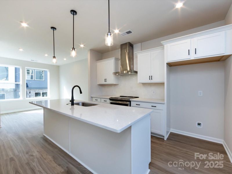 Gourmet Kitchen Layout with Crisp White Selections.