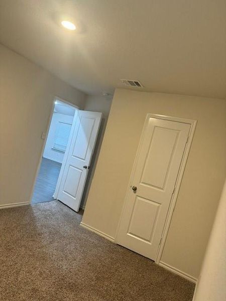 Bonus room with dark carpet