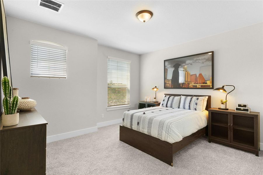 Well-lit sleeping quarters with plush carpet and essential lighting.