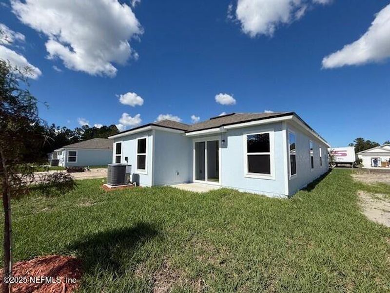 Exterior details and patio area of a home in Grand Reserve, Bunnell (Image 3).
