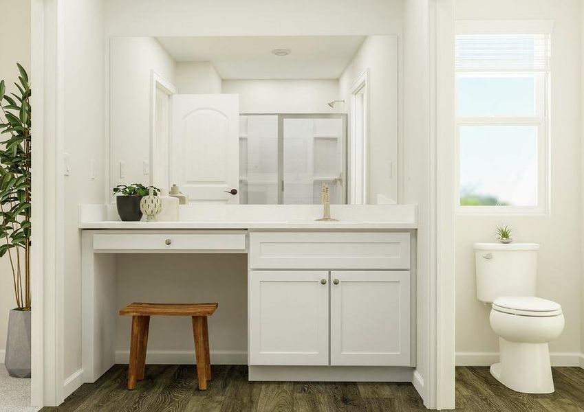 Rendering of the master bath focused on
  the sink with white cabinetry and makeup vanity. The toilet is visible on the
  other side of a wall partition. The shower is reflected in the mirror.