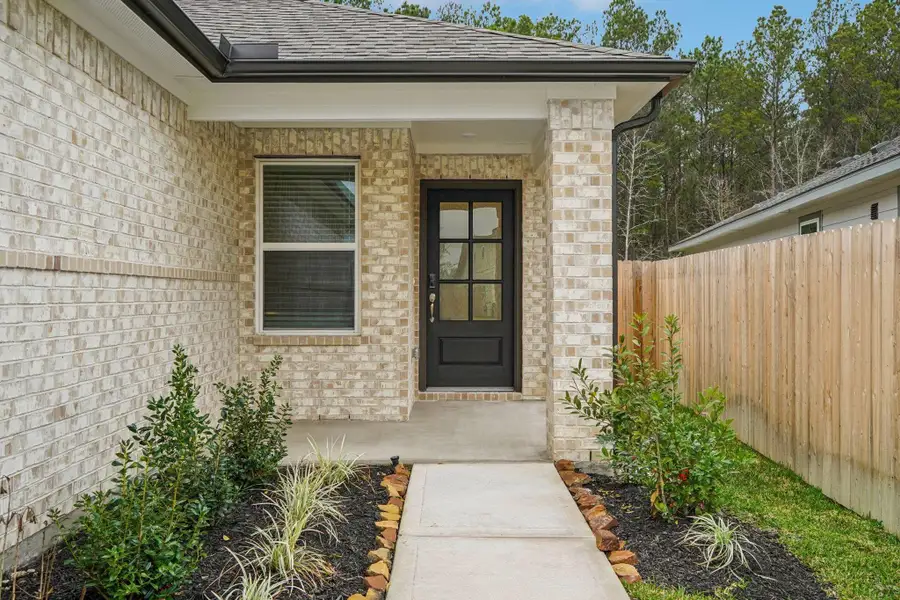 Exterior details and patio area of a home in Landing Meadows - Traditional Series, New Caney (Image 3).