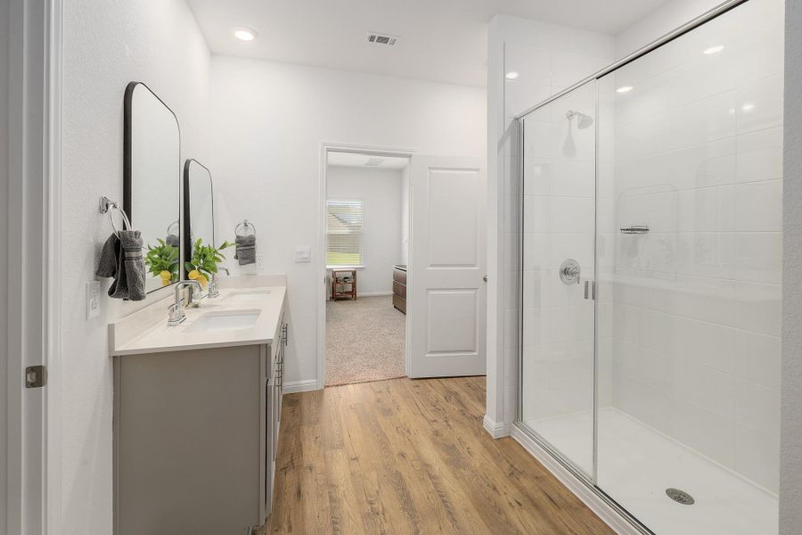 Dual vanity with undermount sinks and light-toned countertops Dual vanity with undermount sinks and light-toned countertops