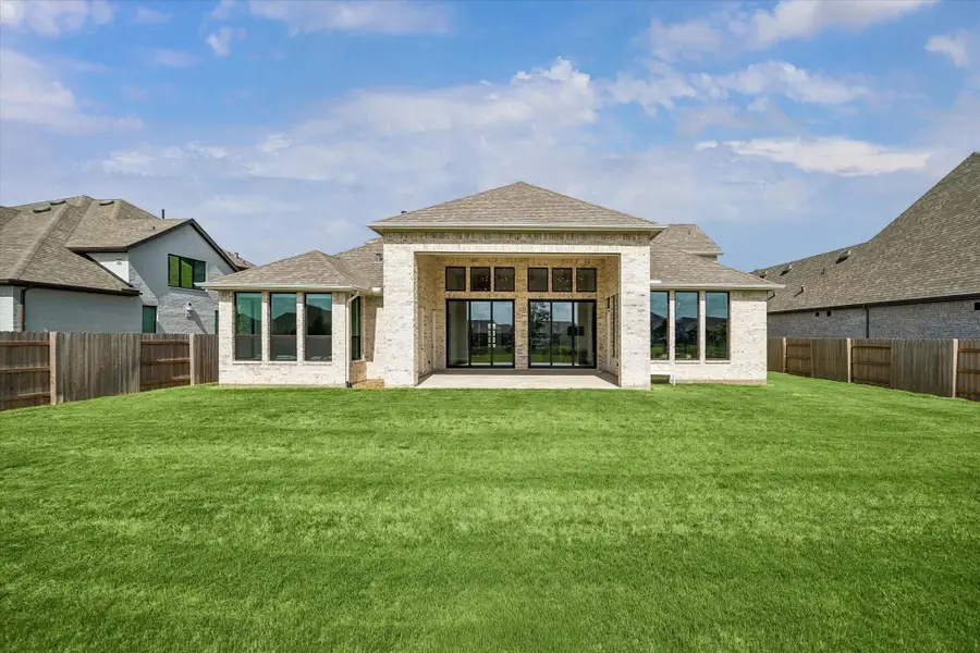 WIDE REAR VIEW SHOWCASES THE EXPANSIVE COVERED PATIO, MULTIPLE OVERSIZED WINDOWS AND SLIDING GLASS DOORS, AND A GENEROUSLY SIZED BACKYARD. WIDE REAR VIEW SHOWCASES THE EXPANSIVE COVERED PATIO, MULTIPLE OVERSIZED WINDOWS AND SLIDING GLASS DOORS, AND A GENEROUSLY SIZED BACKYARD.