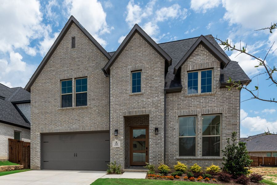 Front exterior of a new home in Tavolo Park, Fort Worth, TX, highlighting curb appeal (Image 25).